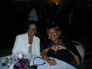 Christine and Mrs. Gomez resting after dancing and eating