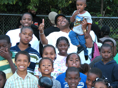 Rev. Hollman and the Kids of the Community
