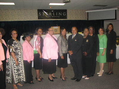 AKA's pose with Brother Gary Griffin, President Rho Upsilon Lambda Chapter of Alpha Phi Alpha Fraternity, Inc.