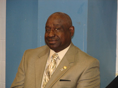 Machroyce Sr. Smiles and he and his son prepare to speak to the Youth